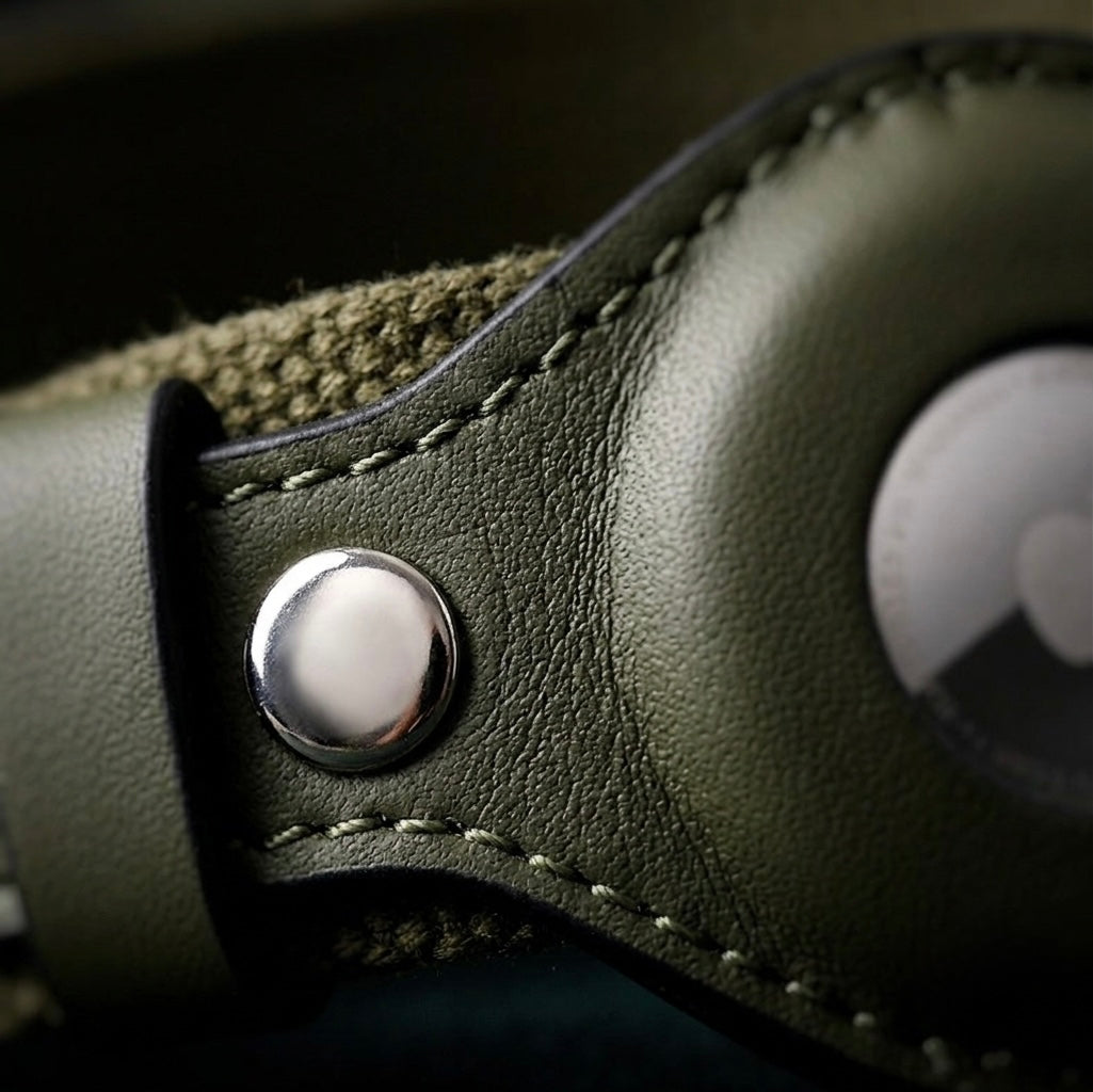 Close-up of the secure AirTag holder on the Midori leather dog collar