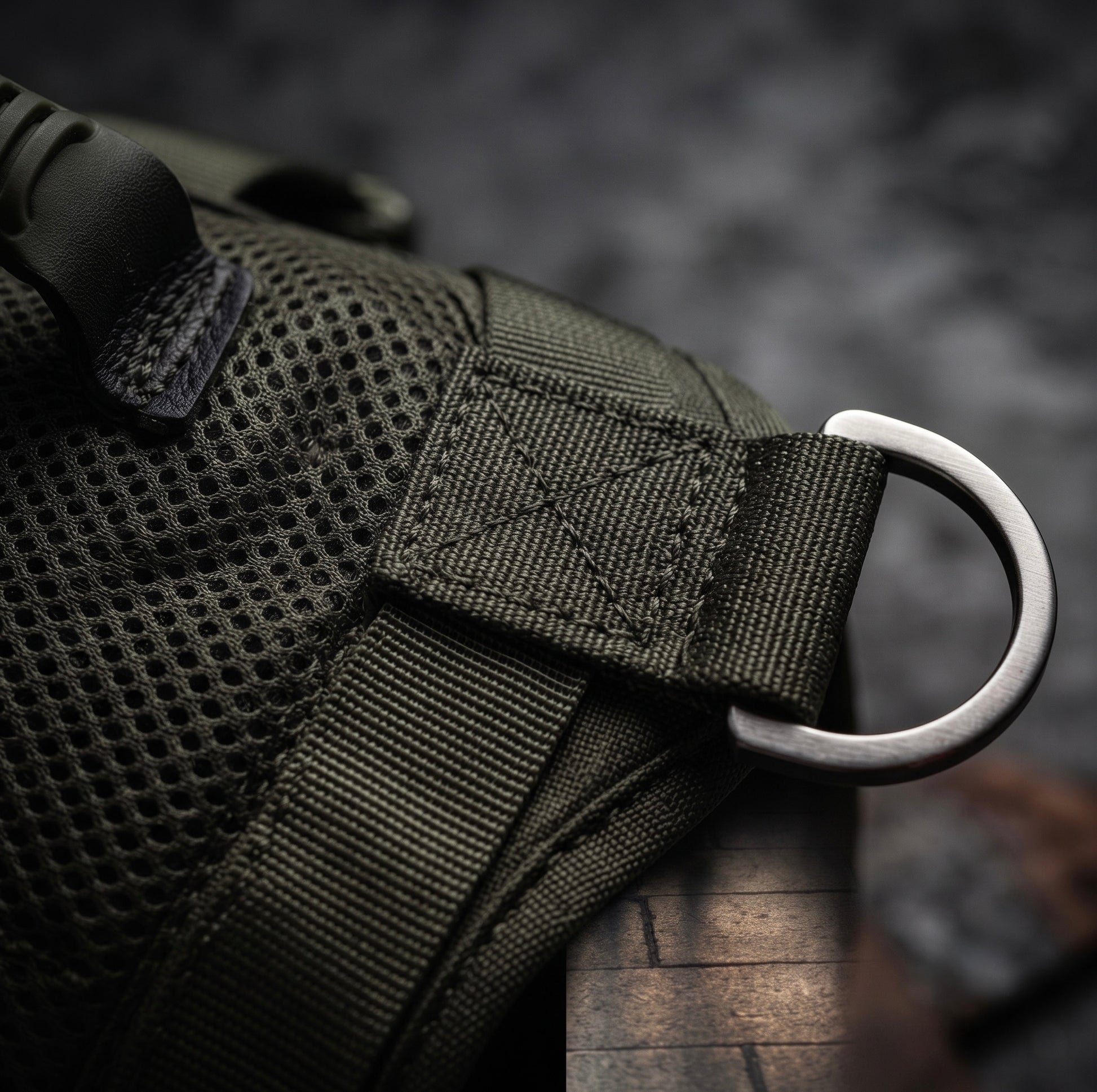 Close-up of the heavy-duty metal D-ring and reinforced stitching on the Midori tactical dog harness